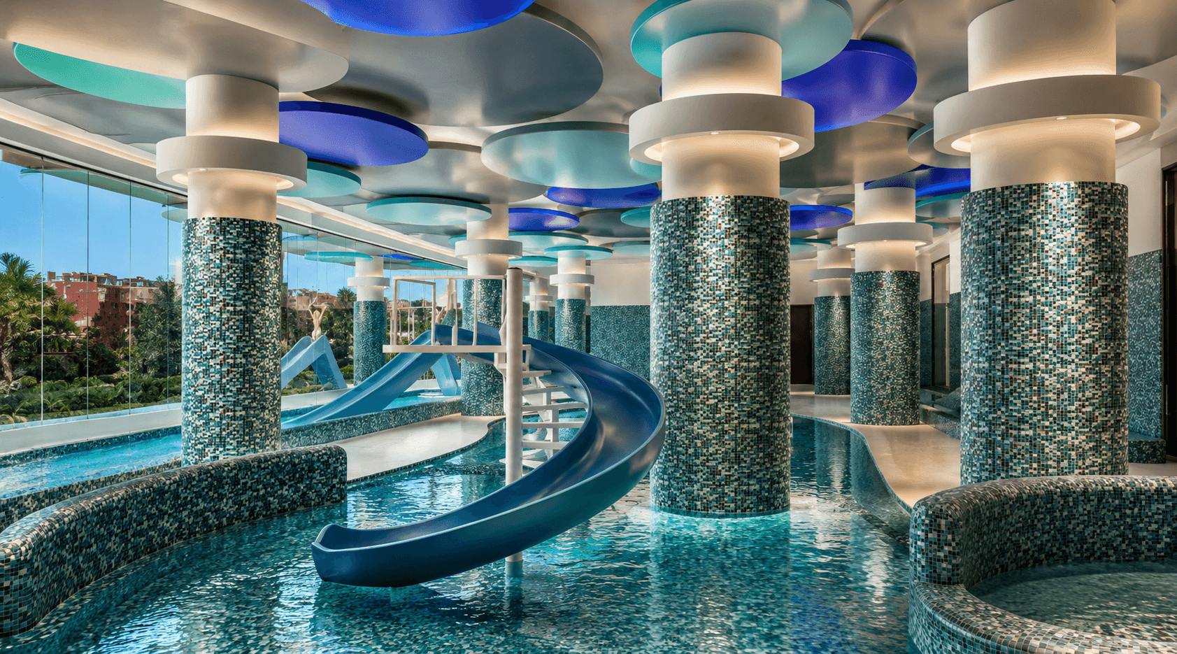 Indoor aquatic park with water slides at Hotel Venecia